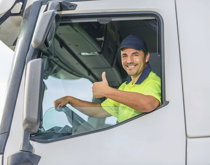 Happy truck driver giving thumbs up